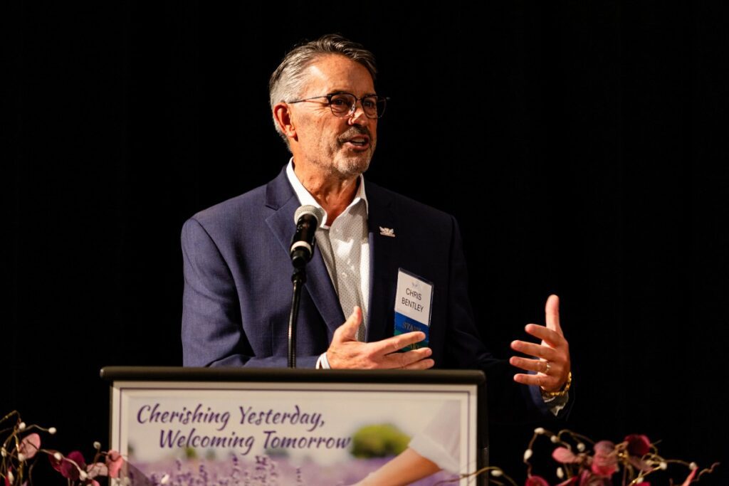 Chris Bentley speaking at a Wings for Widows luncheon.